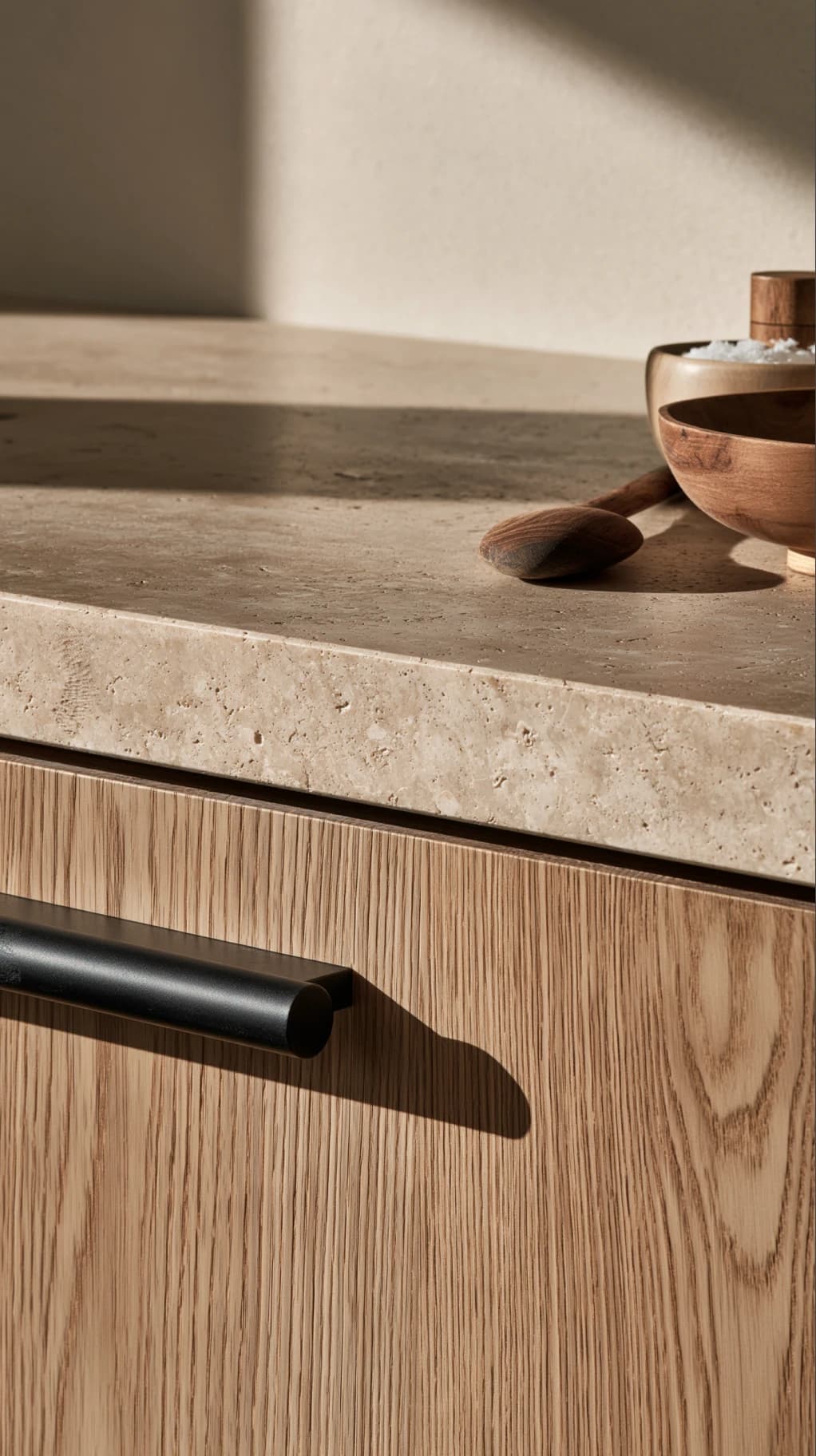 Stone worktop over oak joinery